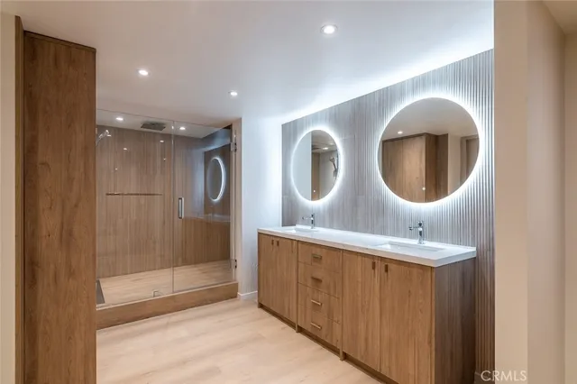 a bathroom with a double vanity sink and mirror