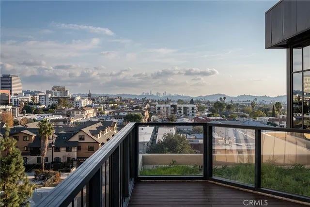 a view of a kitchen with a sink and cabinets
