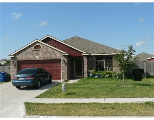 a car parked in front of a house
