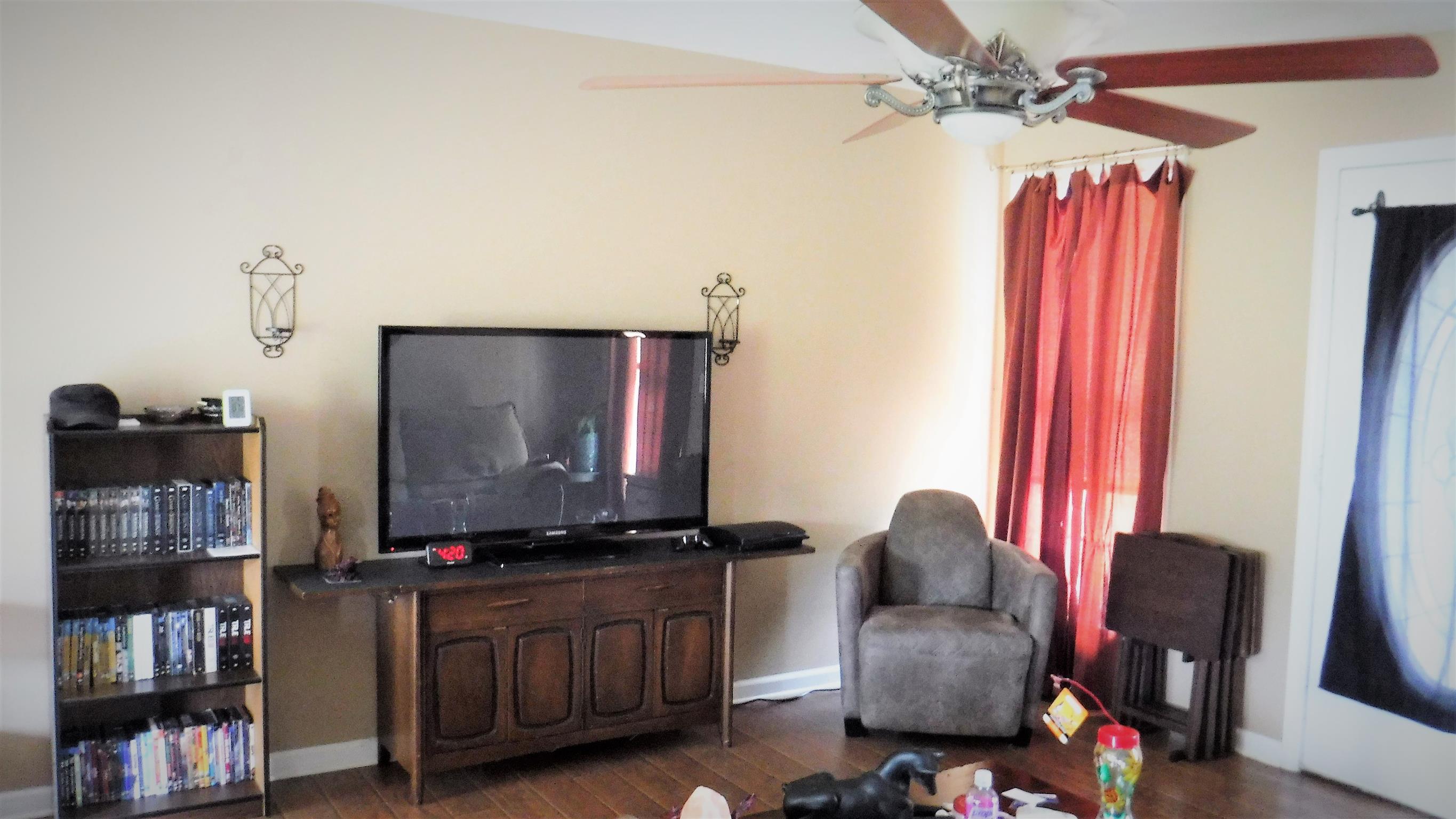 8 Merideth Lynn Road Fayetteville, TN 37334 - Photo 12 of 19 a room with furniture and a flat screen tv