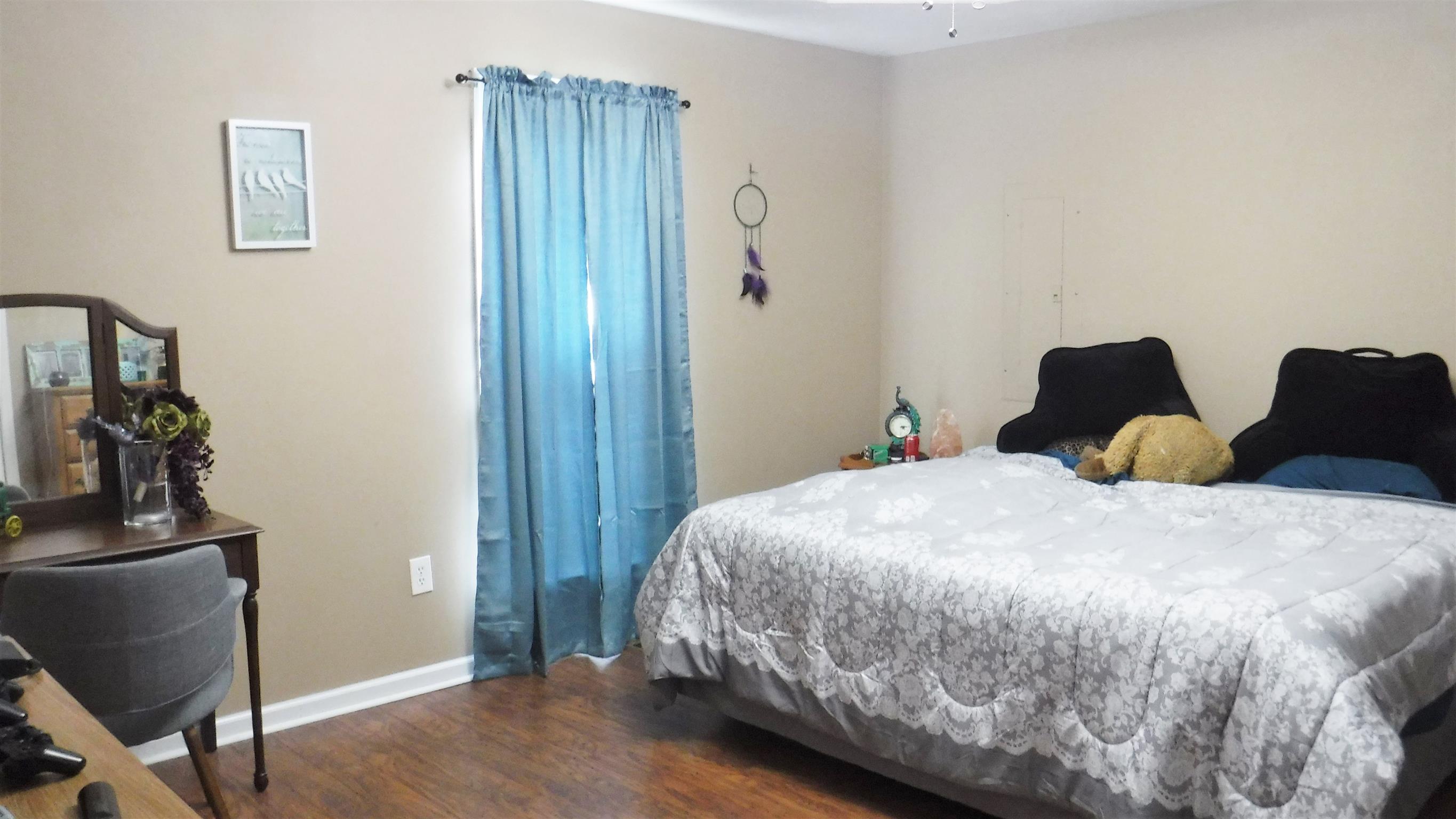 8 Merideth Lynn Road Fayetteville, TN 37334 - Photo 15 of 19 a bedroom with a bed and wooden floor