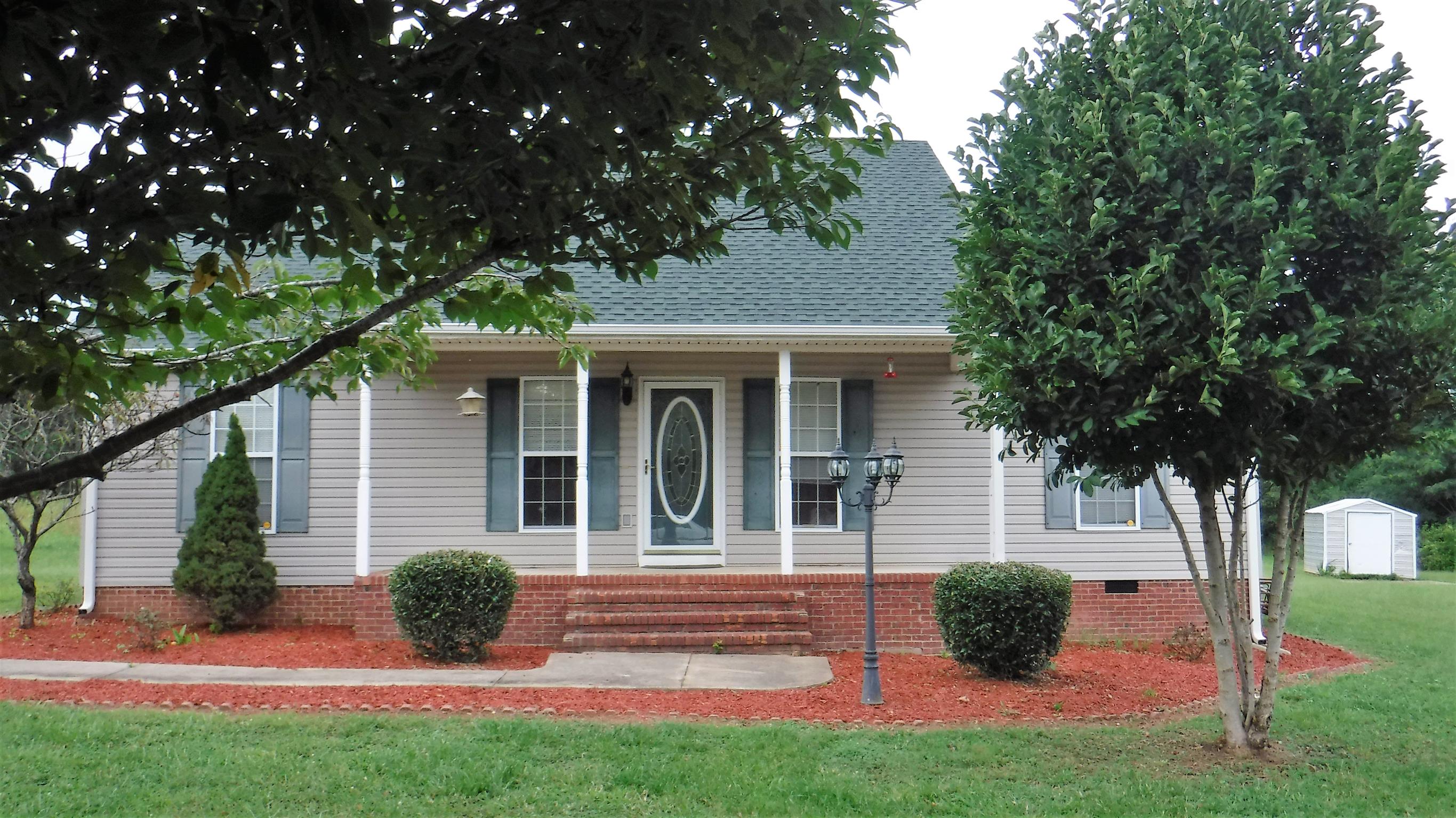 8 Merideth Lynn Road Fayetteville, TN 37334 - Photo 2 of 19 front view of a house with a yard