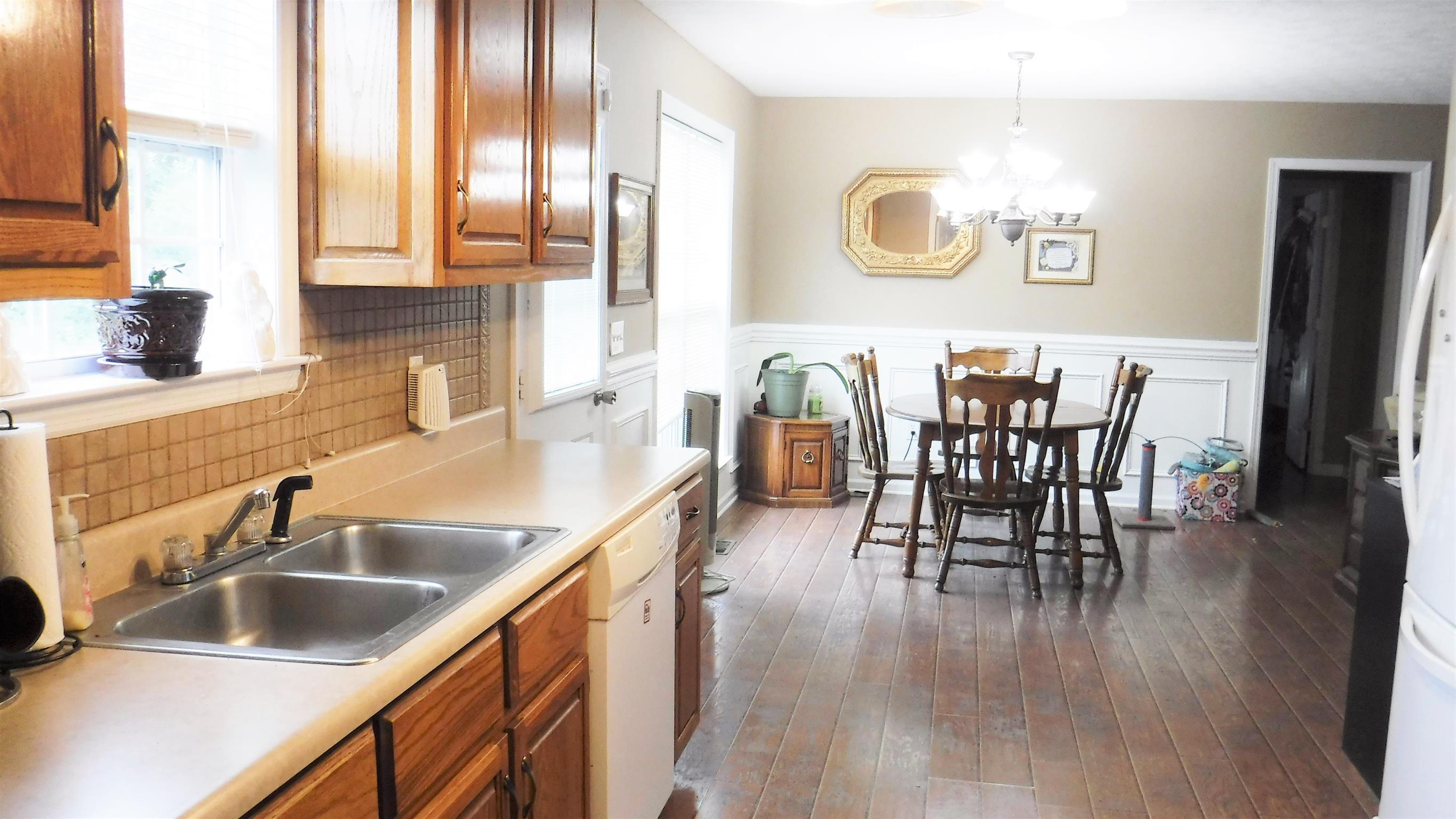 8 Merideth Lynn Road Fayetteville, TN 37334 - Photo 4 of 19 a kitchen with stainless steel appliances granite countertop a sink table and chairs