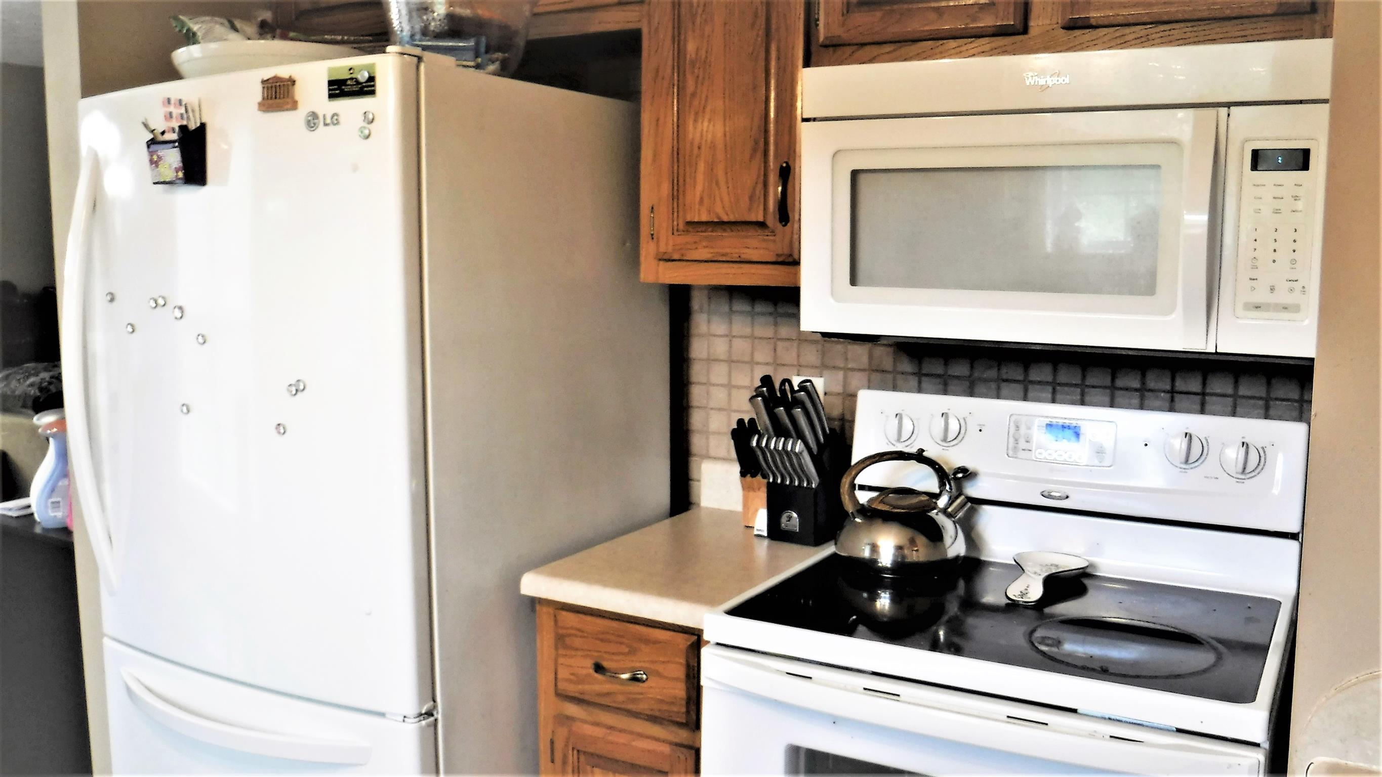 8 Merideth Lynn Road Fayetteville, TN 37334 - Photo 6 of 19 a close view of a sink a stove and a refrigerator