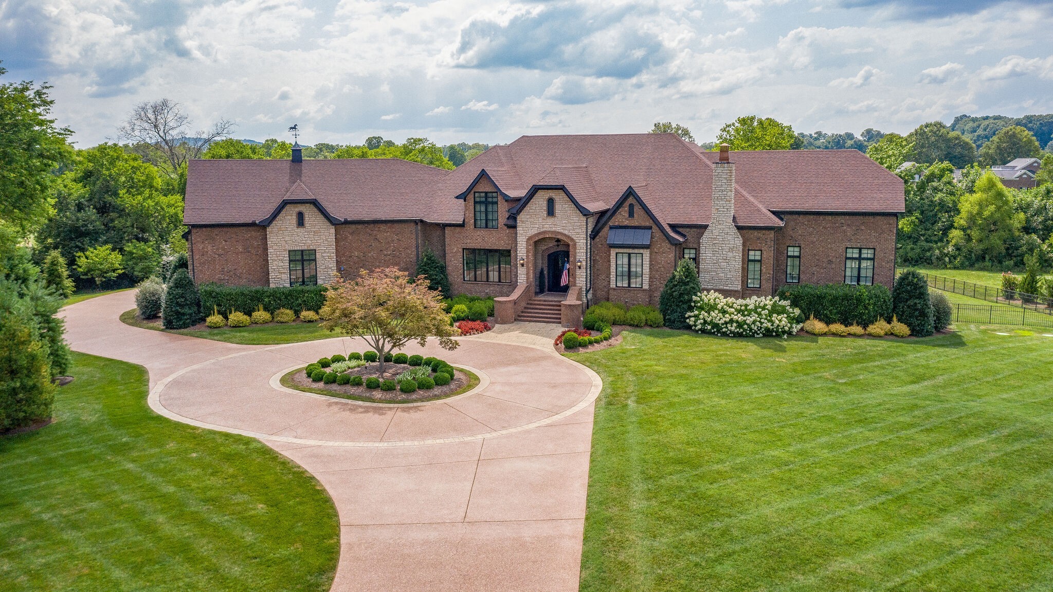 4411 Peytona Lane Franklin, TN 37064 - Photo 1 of 50 a front view of a house with a garden and plants