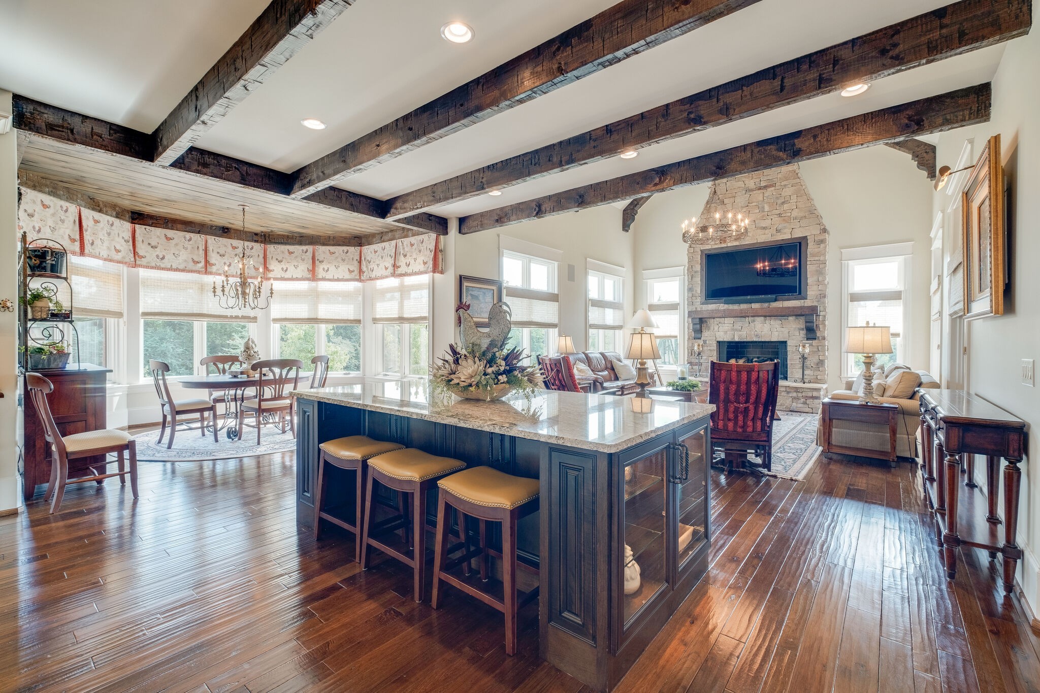 4411 Peytona Lane Franklin, TN 37064 - Photo 18 of 50 a kitchen with stainless steel appliances granite countertop lots of wooden furniture dining table and chairs