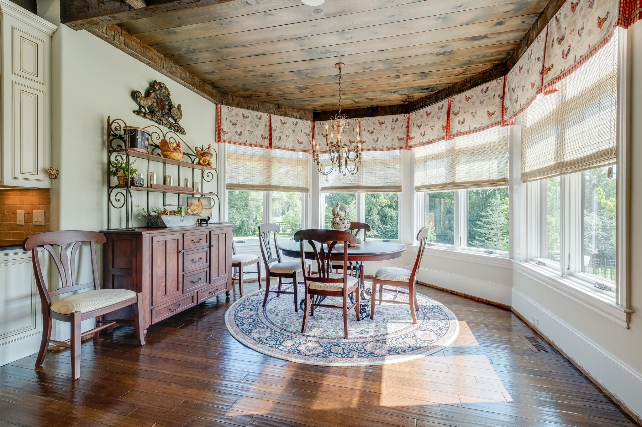 4411 Peytona Lane Franklin, TN 37064 - Photo 19 of 50 a dining room with furniture a chandelier and wooden floor