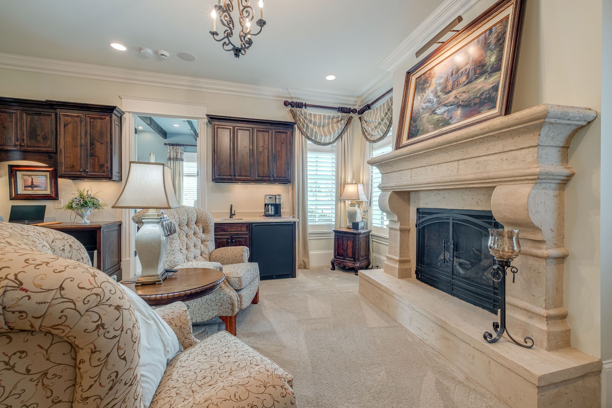 4411 Peytona Lane Franklin, TN 37064 - Photo 21 of 50 a living room with furniture a fireplace and a kitchen view