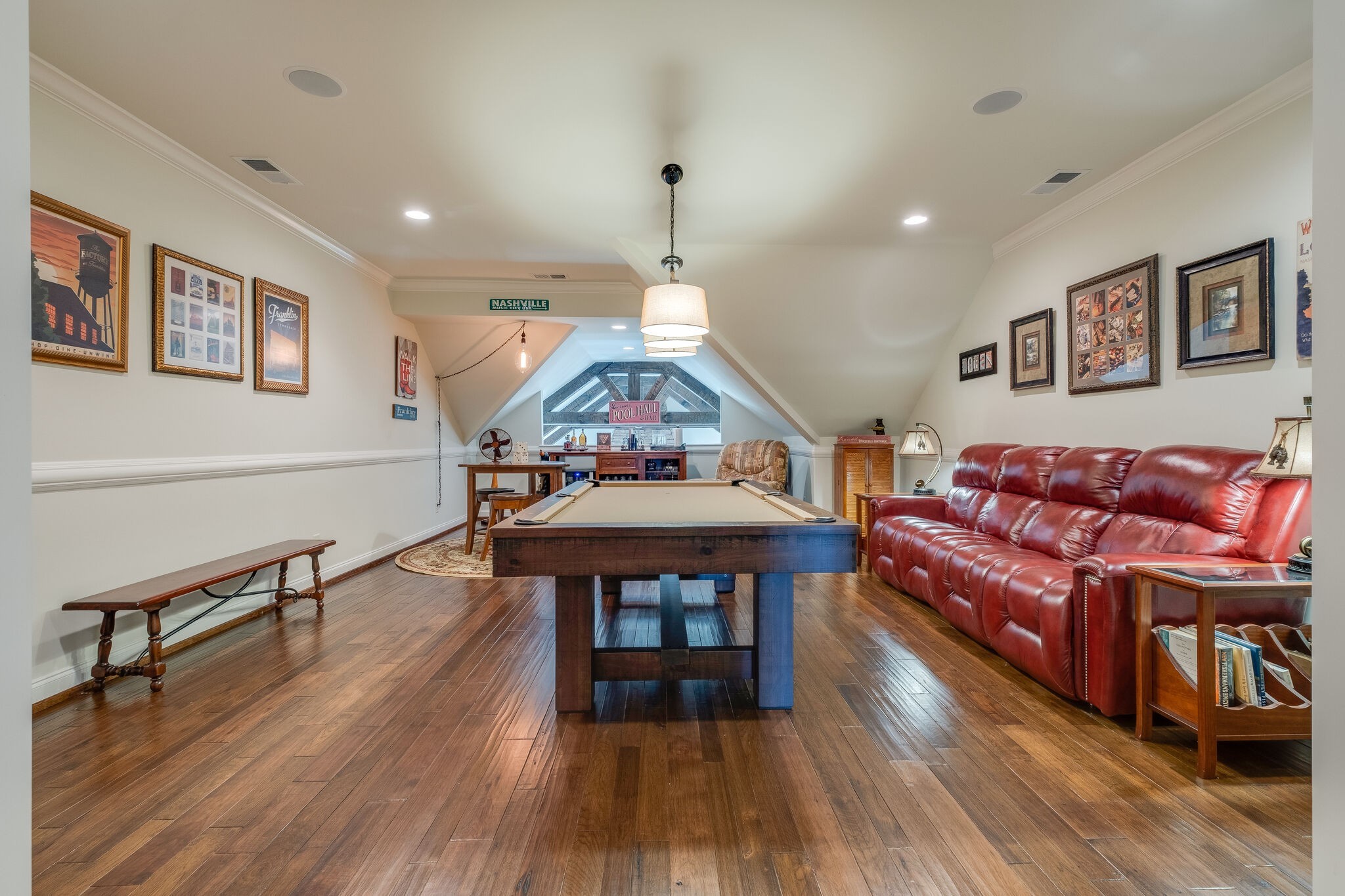 4411 Peytona Lane Franklin, TN 37064 - Photo 31 of 50 a living room with furniture a wooden floor and a chandelier