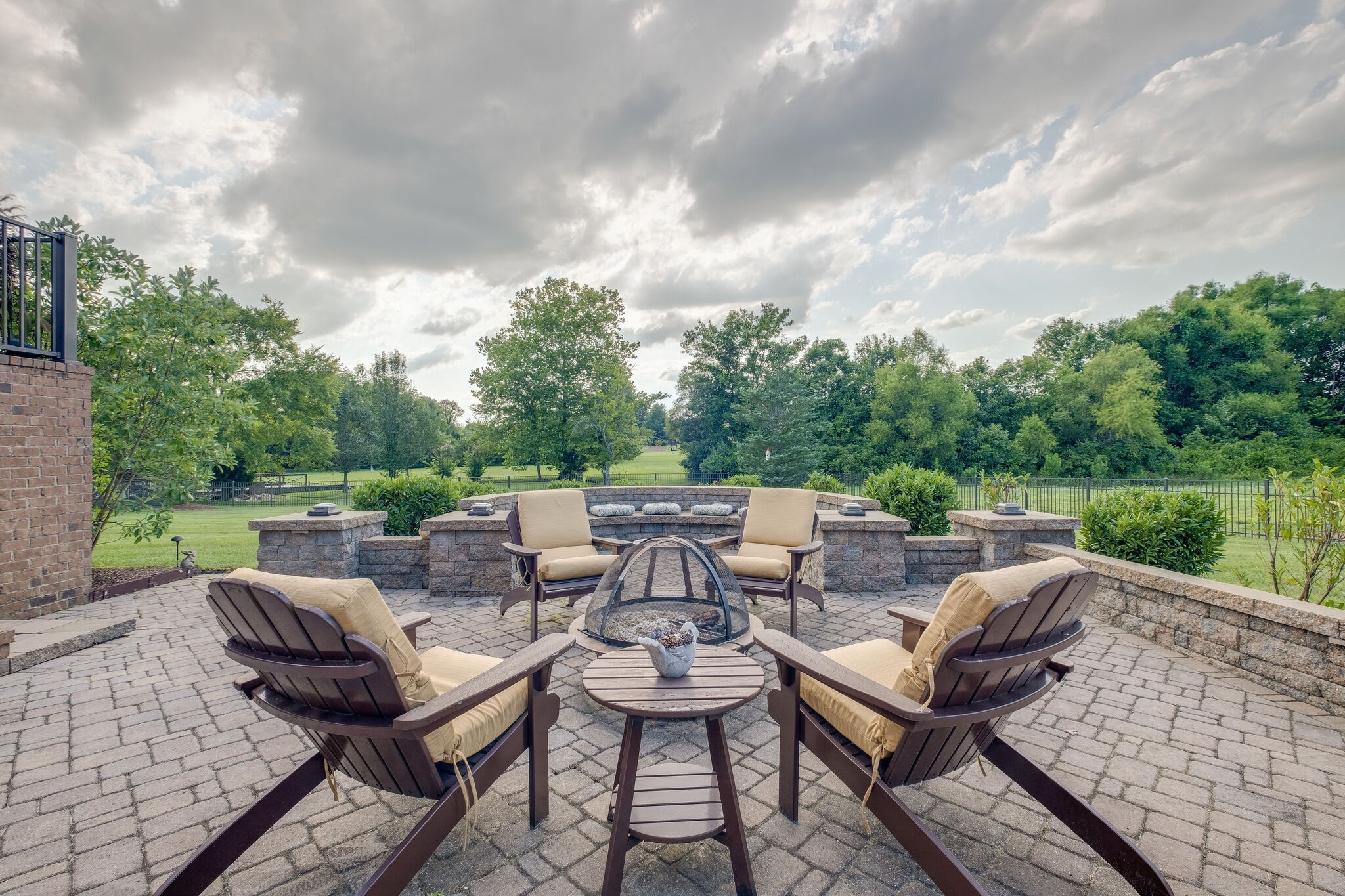 4411 Peytona Lane Franklin, TN 37064 - Photo 41 of 50 an outdoor sitting area with furniture and a garden