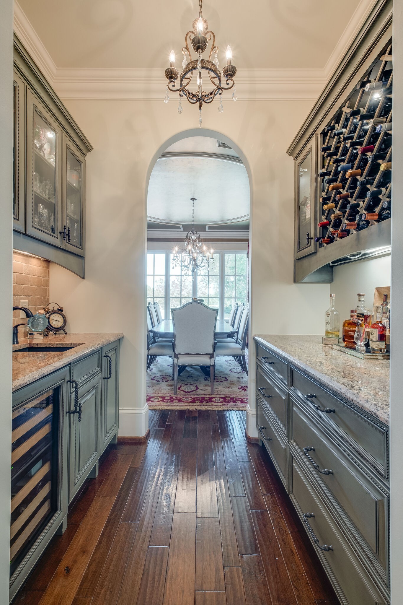 4411 Peytona Lane Franklin, TN 37064 - Photo 9 of 50 a kitchen with wooden floors a sink and a stove