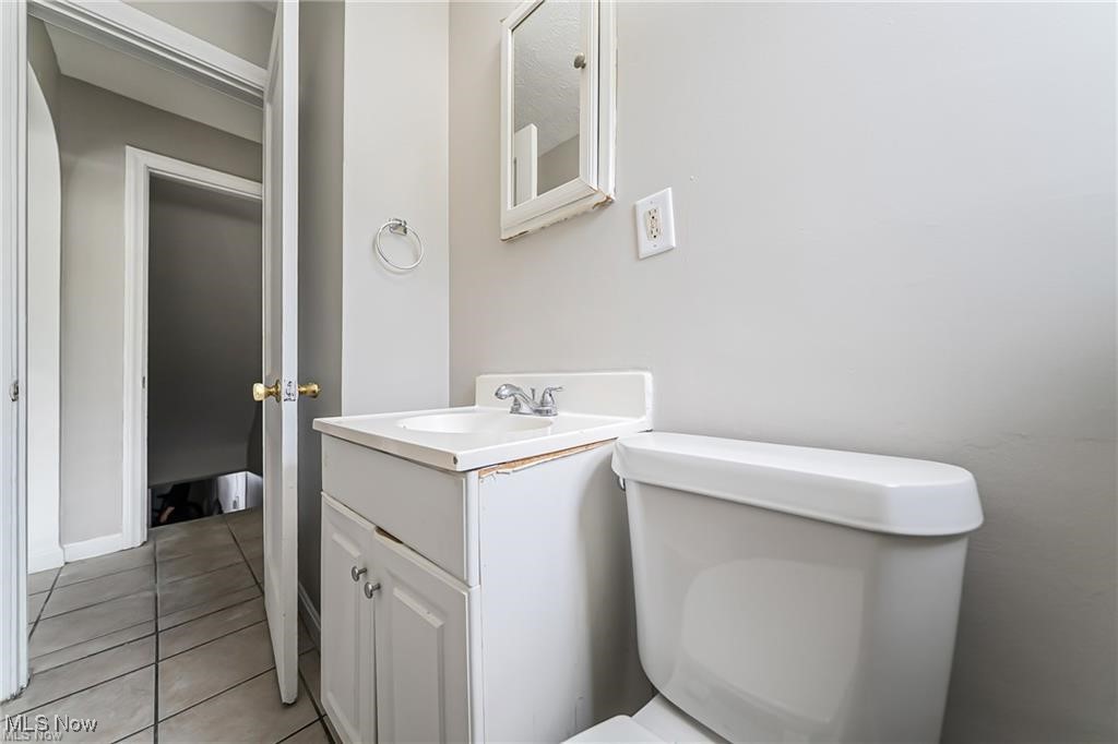 3837 Mayfield Road Cleveland, OH 44121 - Photo 10 of 29 Bathroom with vanity and light tile patterned flooring