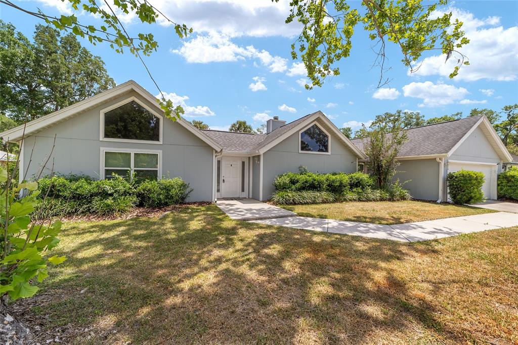2159 Southeast 7th Terrace Ocala, FL 34471 - Photo 1 of 59 a view of a house with a yard and large tree
