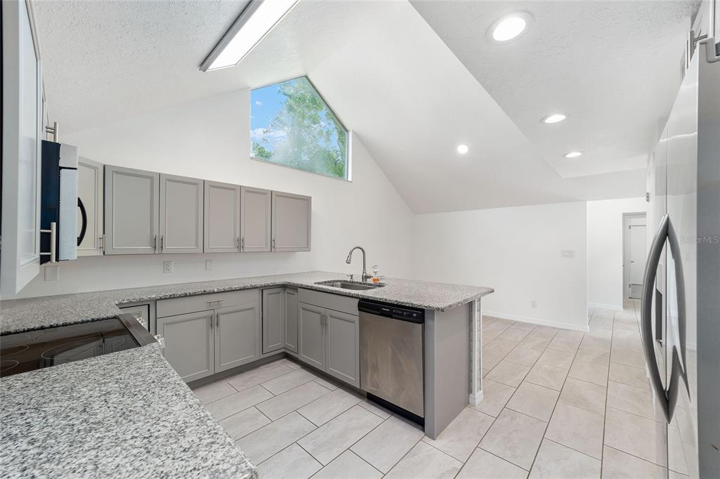 2159 Southeast 7th Terrace Ocala, FL 34471 - Photo 20 of 59 a kitchen with a sink and cabinets