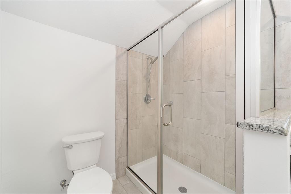 2159 Southeast 7th Terrace Ocala, FL 34471 - Photo 28 of 59 a white toilet sitting next to a bath tub