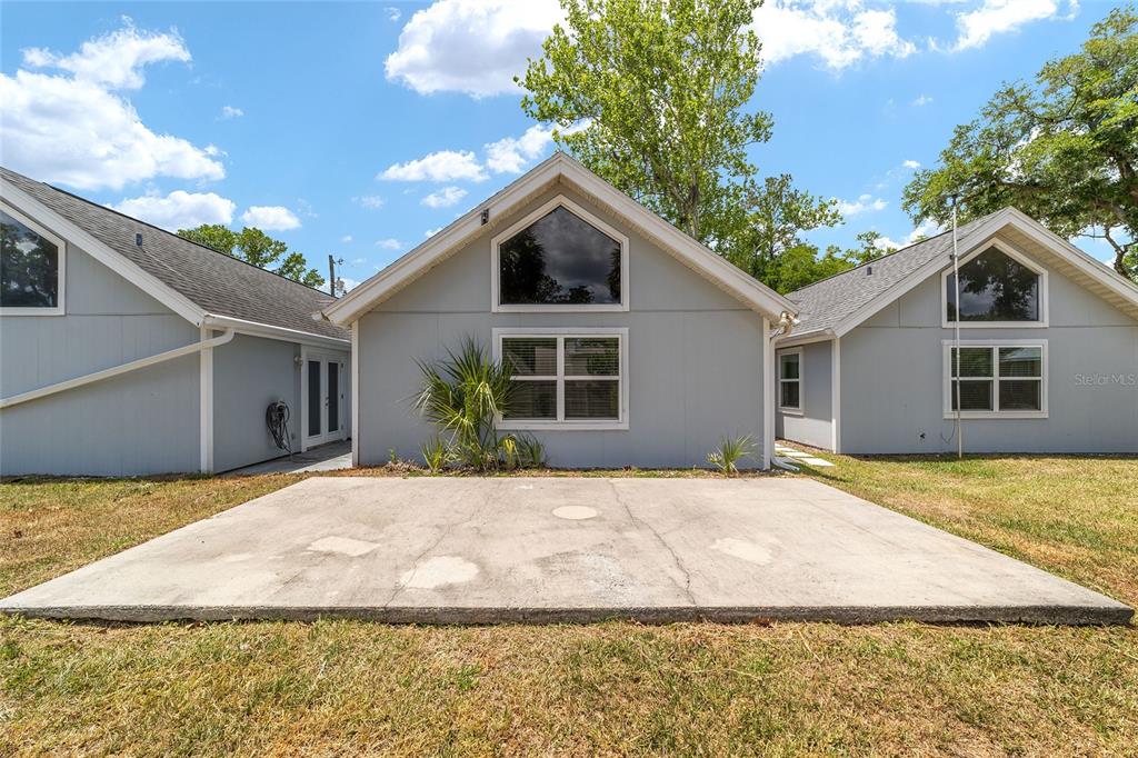 2159 Southeast 7th Terrace Ocala, FL 34471 - Photo 41 of 59 a front view of a house with a garden