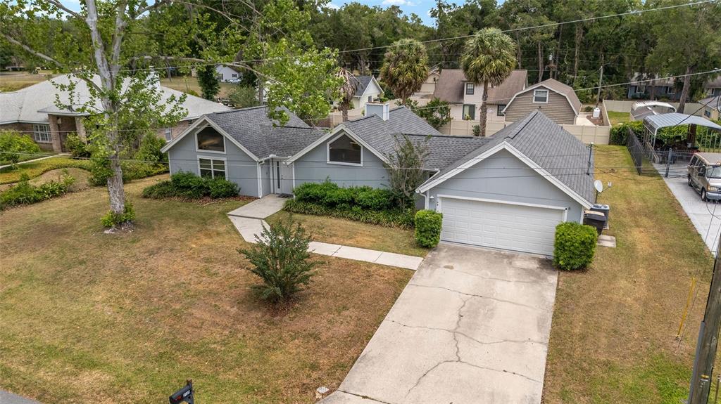 2159 Southeast 7th Terrace Ocala, FL 34471 - Photo 49 of 59 a view of a house with a yard and large tree