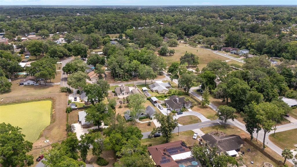 2159 Southeast 7th Terrace Ocala, FL 34471 - Photo 52 of 59 an aerial view of residential houses with outdoor space and trees