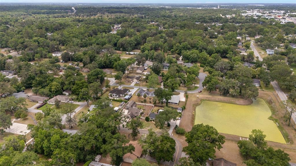 2159 Southeast 7th Terrace Ocala, FL 34471 - Photo 59 of 59 an aerial view of residential houses with outdoor space and trees