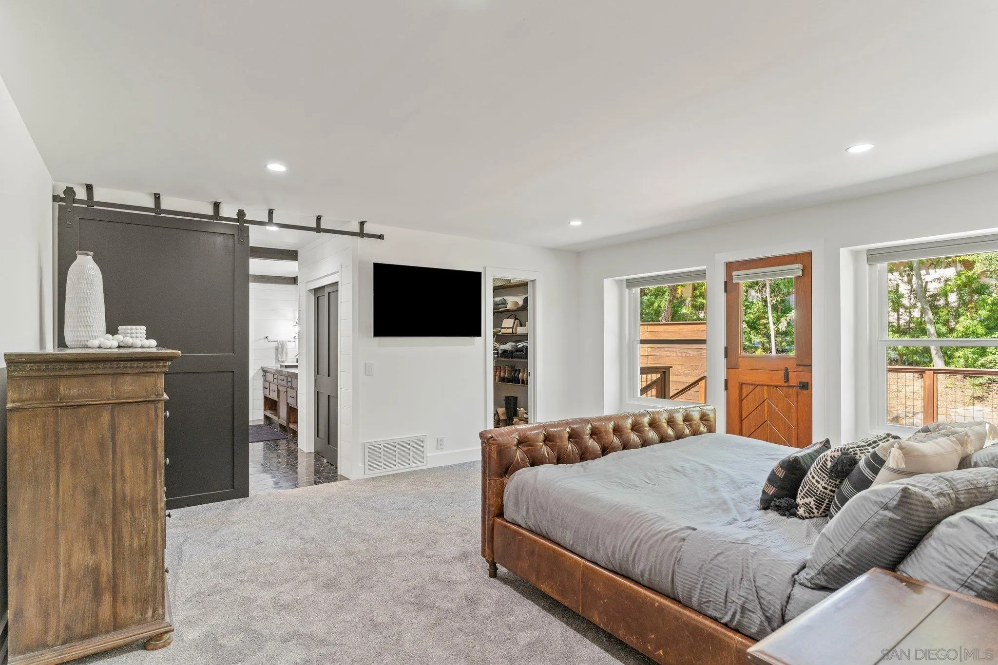 13229 Stone Canyon Road Poway, CA 92064 - Photo 14 of 29 a bedroom with a large bed and a flat screen tv