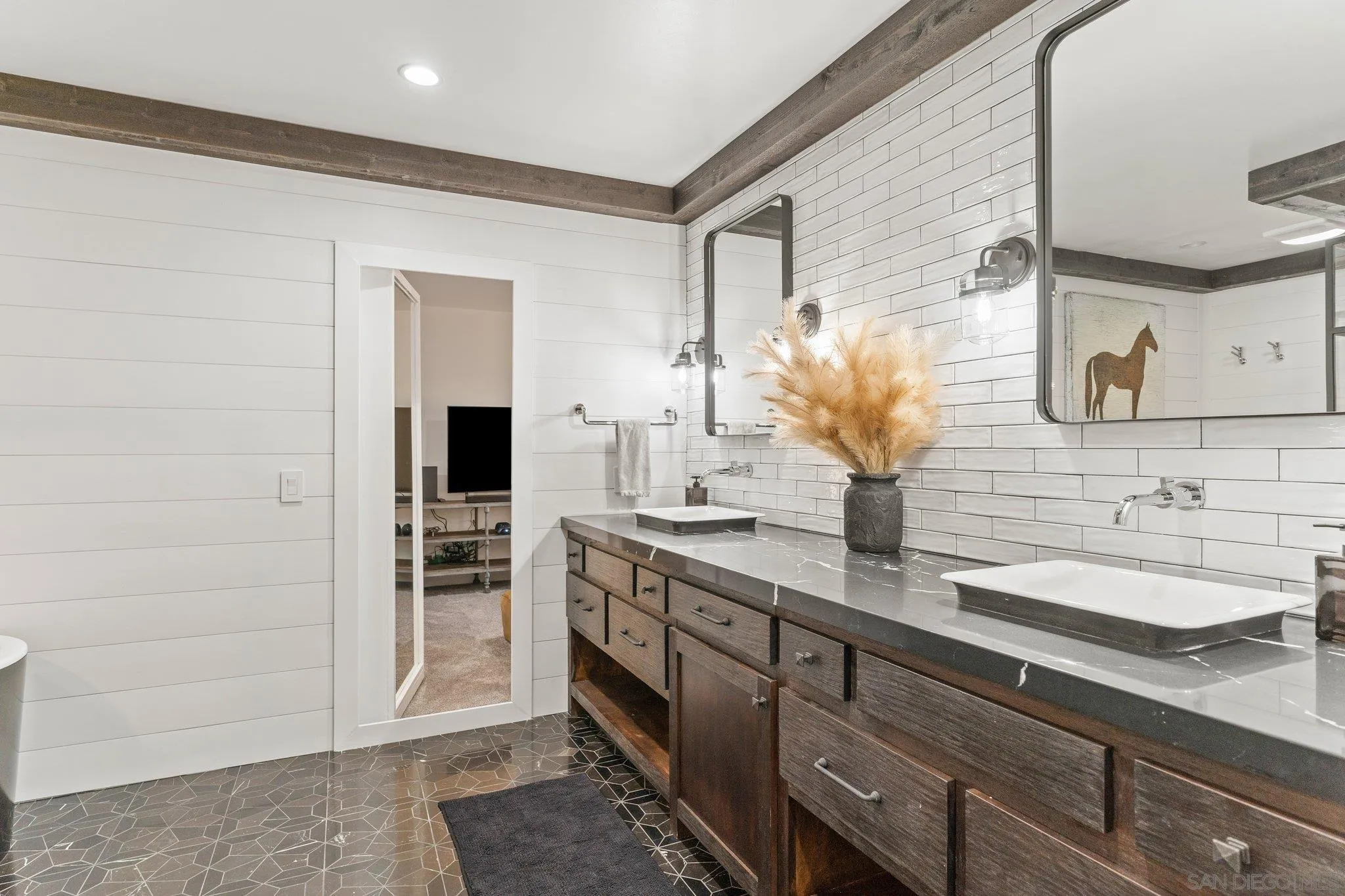 13229 Stone Canyon Road Poway, CA 92064 - Photo 16 of 29 a bathroom with a double vanity sink and a mirror