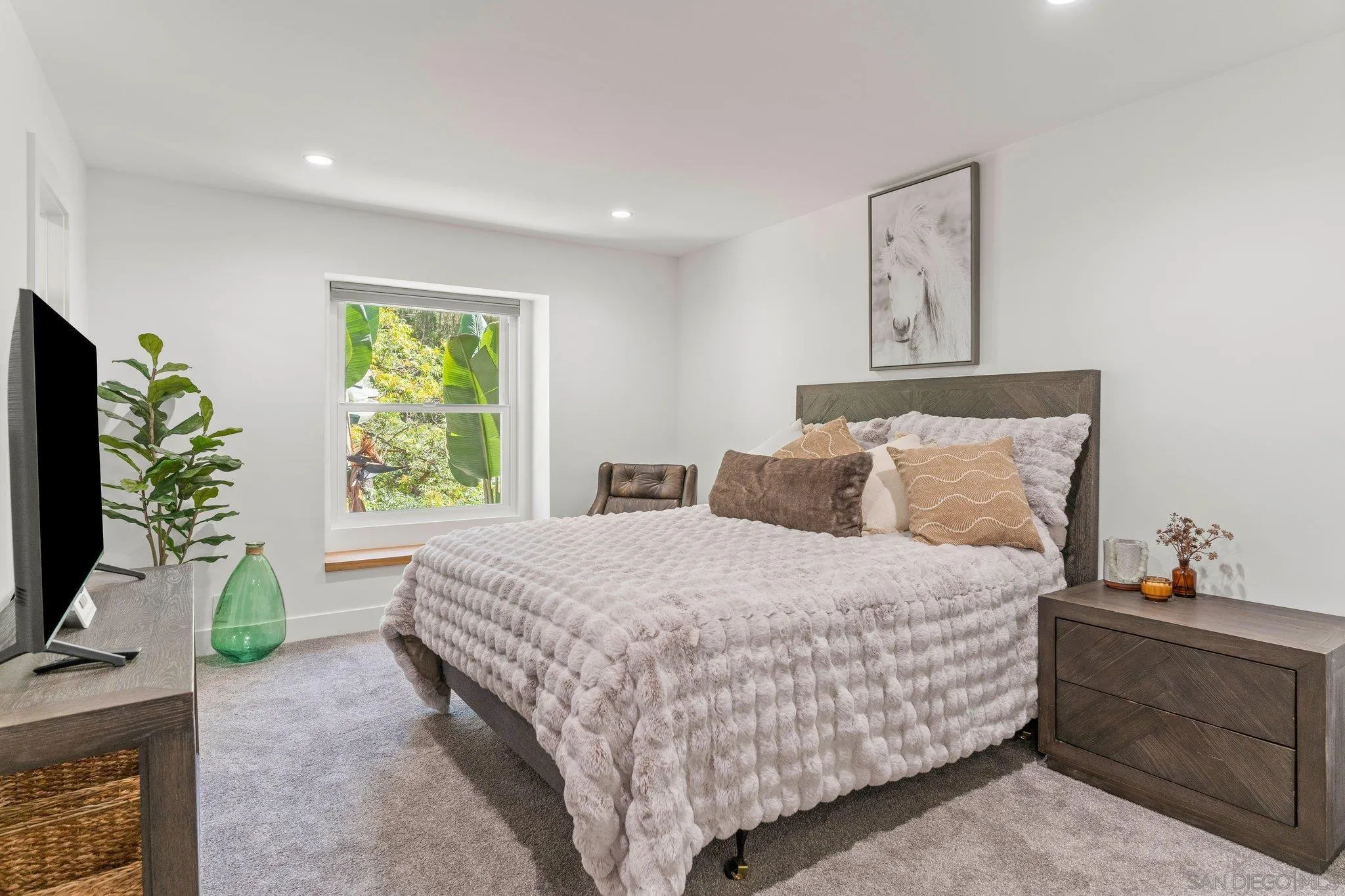 13229 Stone Canyon Road Poway, CA 92064 - Photo 22 of 29 a bedroom with bed and window