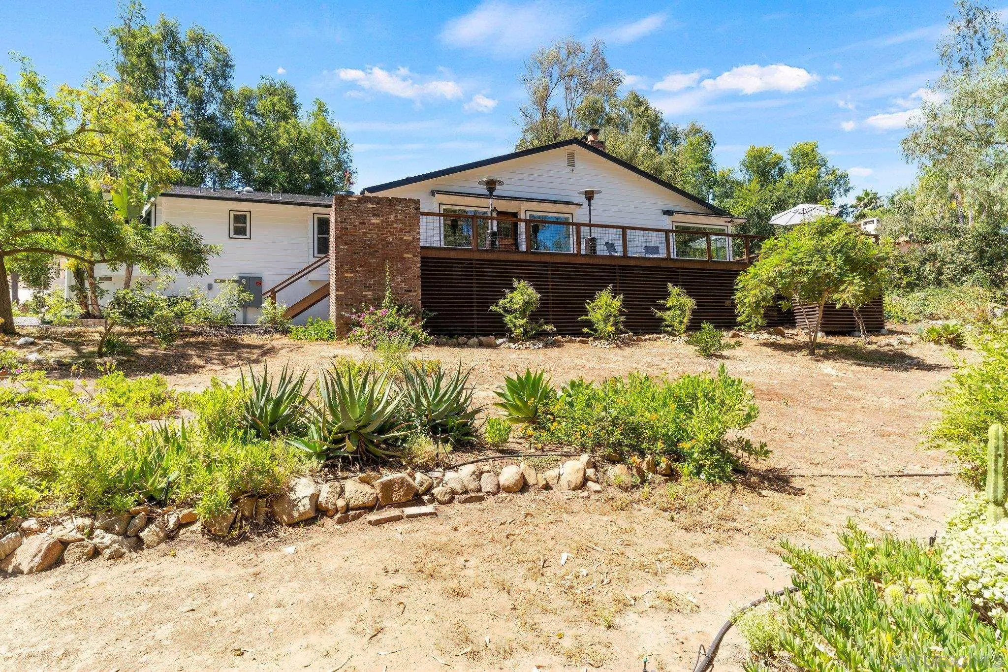 13229 Stone Canyon Road Poway, CA 92064 - Photo 28 of 29 a front view of a house with a yard