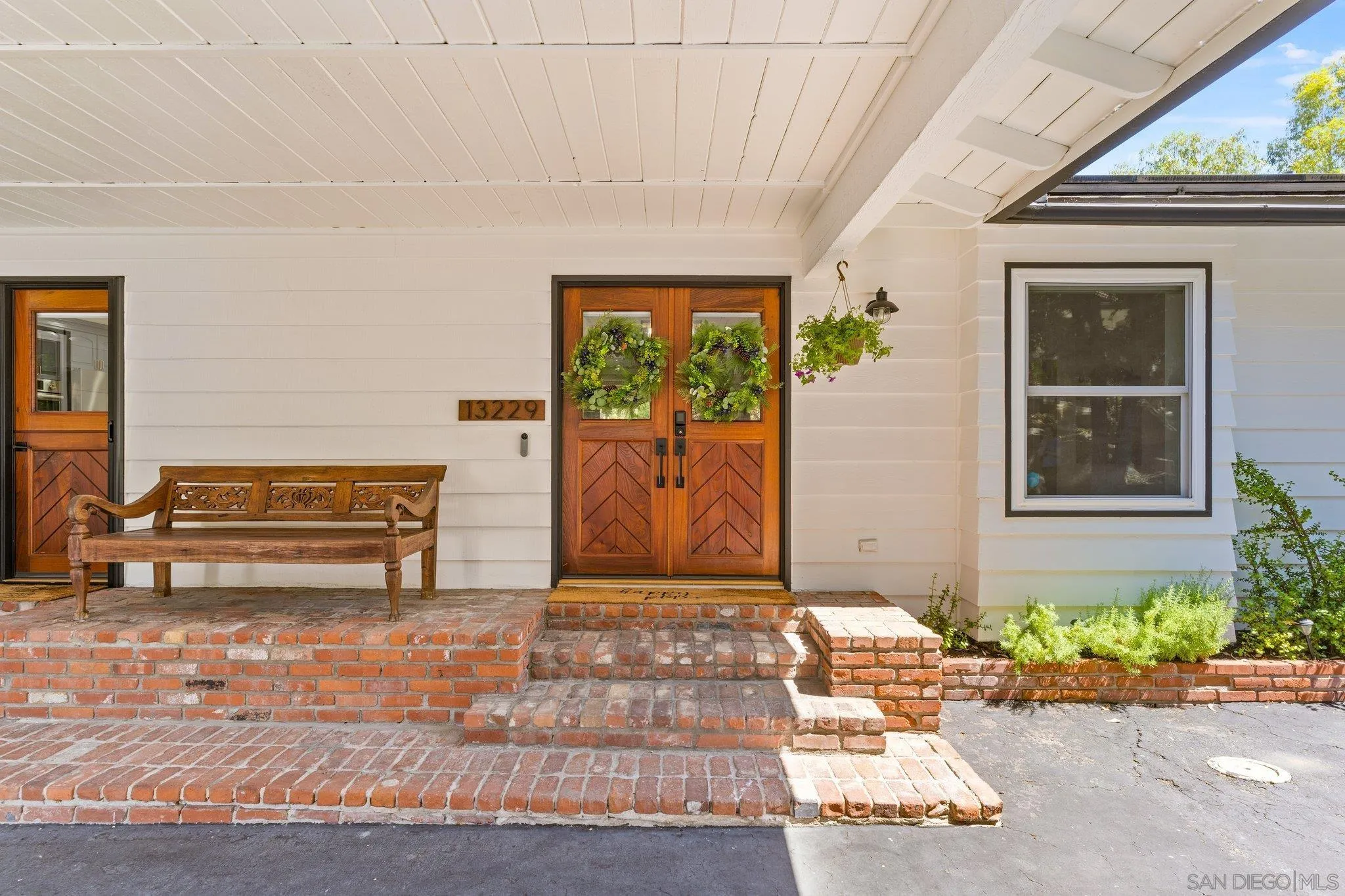 13229 Stone Canyon Road Poway, CA 92064 - Photo 3 of 29 a view of a entryway door front of house