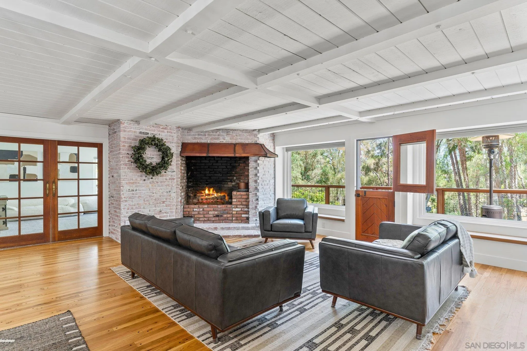 13229 Stone Canyon Road Poway, CA 92064 - Photo 5 of 29 a living room with furniture and a flat screen tv