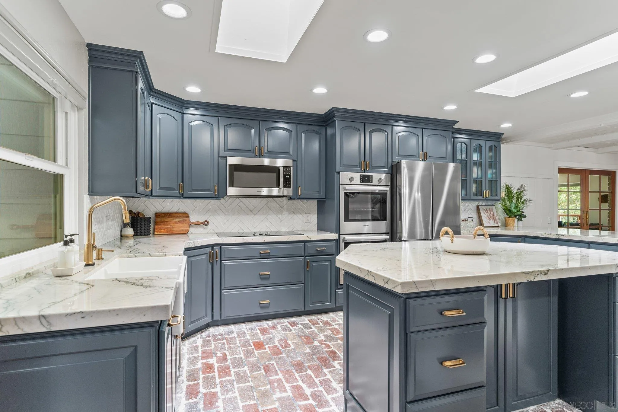 13229 Stone Canyon Road Poway, CA 92064 - Photo 8 of 29 a kitchen with kitchen island granite countertop appliances cabinets and a sink