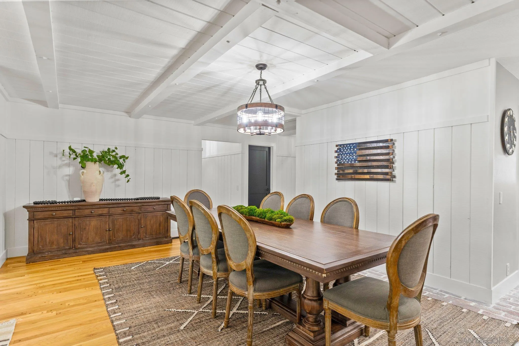 13229 Stone Canyon Road Poway, CA 92064 - Photo 10 of 29 a dining room with furniture potted plants and wooden floor
