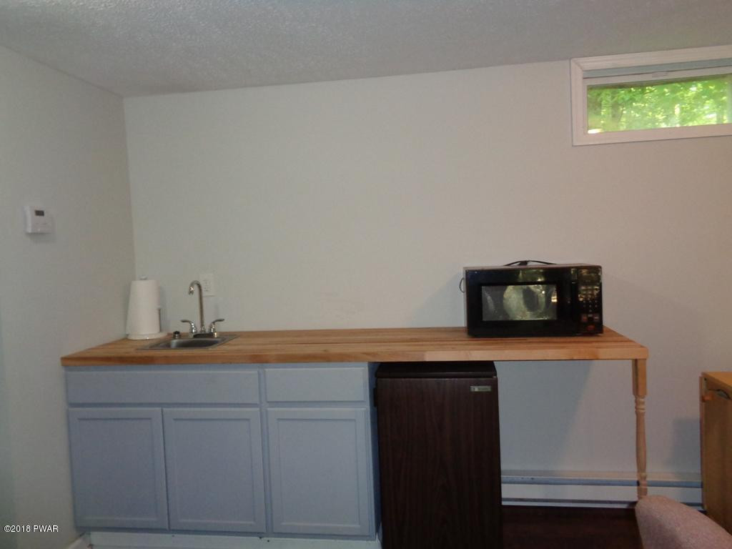 108 Oakridge Court Hawley, PA 18428 - Photo 19 of 43 Lower level kitchenette