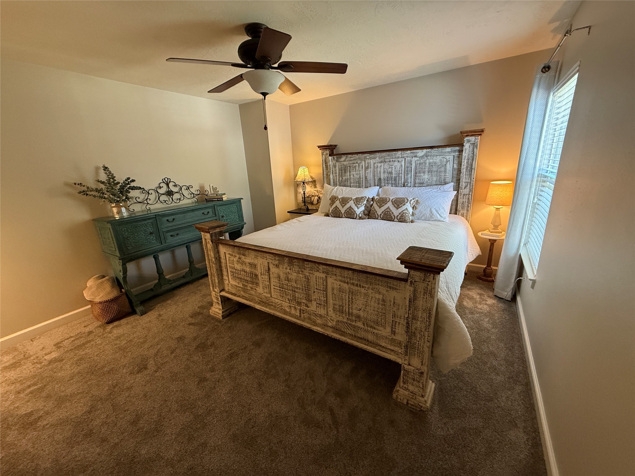 1631 Andrew Chase Lane Spring, TX 77386 - Photo 10 of 16 a bedroom with a bed and a chandelier fan
