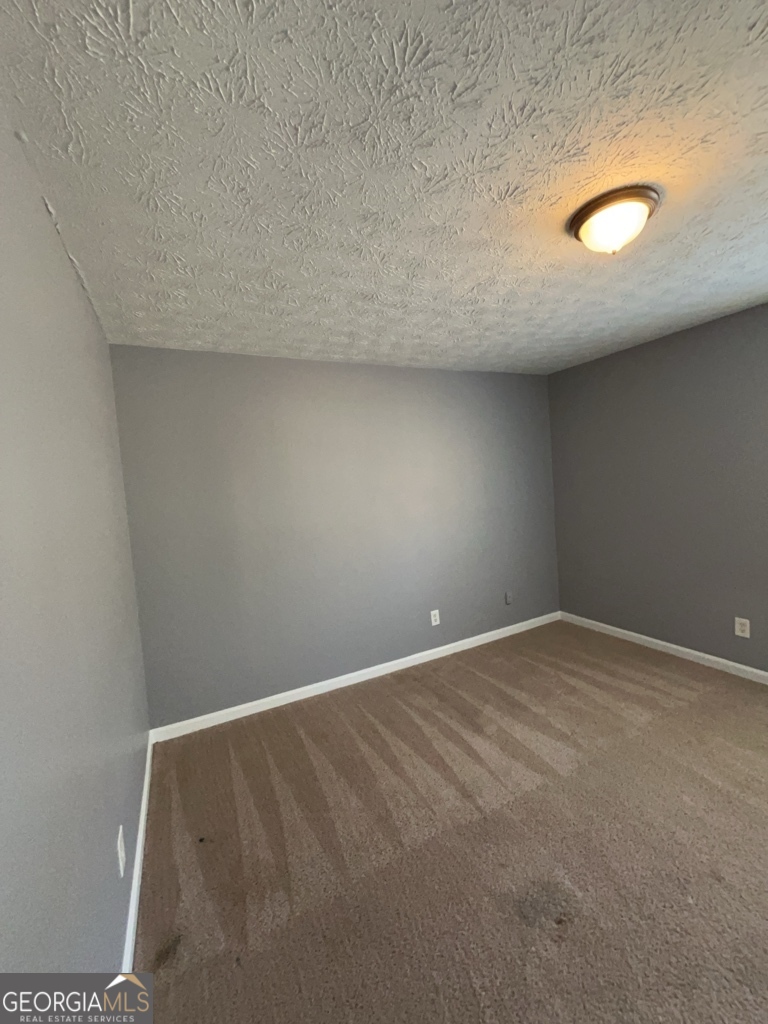 1682 Charmeth Road Lithonia, GA 30058 - Photo 17 of 52 a view of an empty room