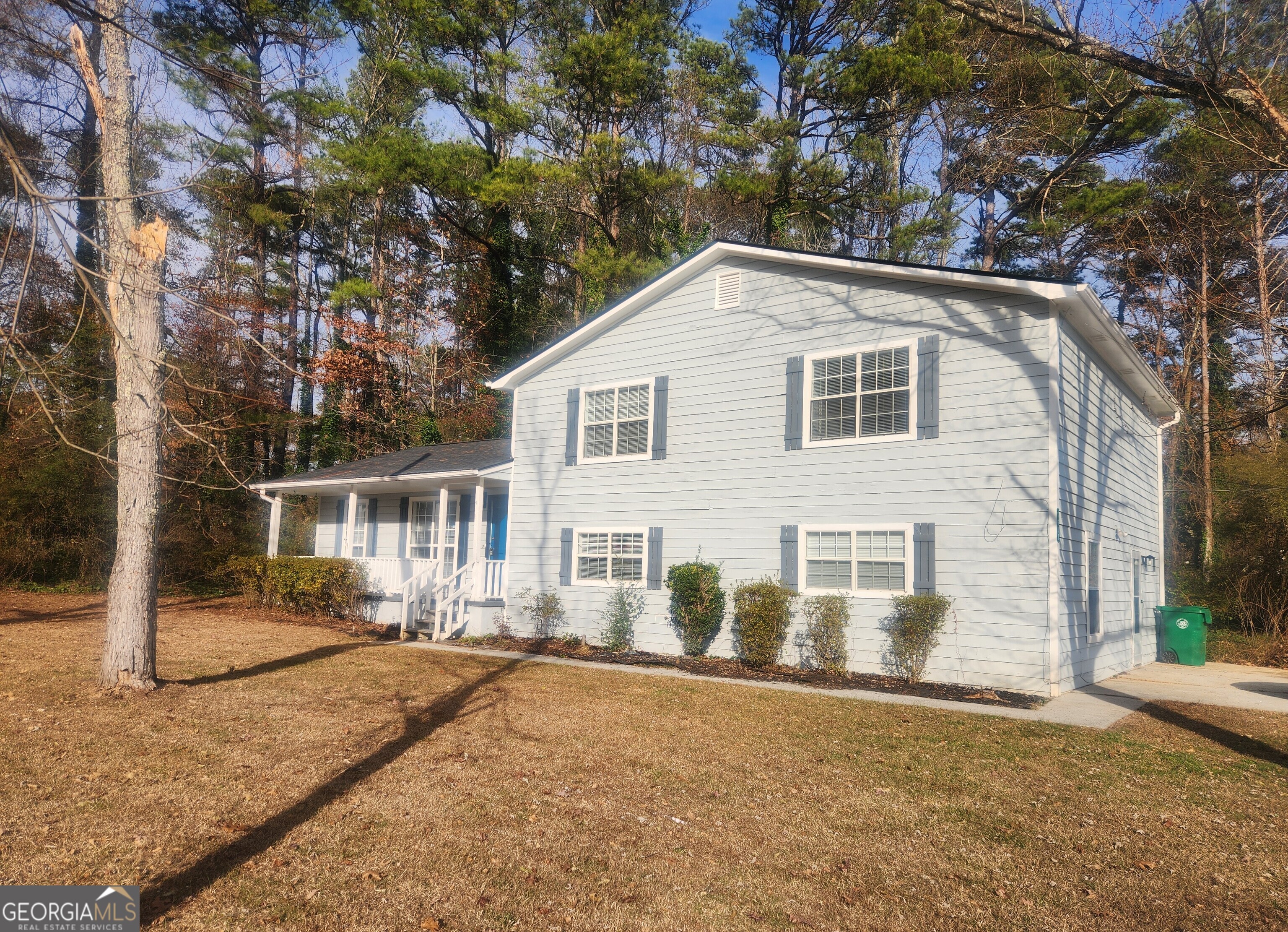 1682 Charmeth Road Lithonia, GA 30058 - Photo 2 of 52 a front view of a house with yard