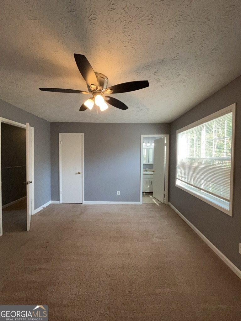 1682 Charmeth Road Lithonia, GA 30058 - Photo 24 of 52 a view of an empty room with a window
