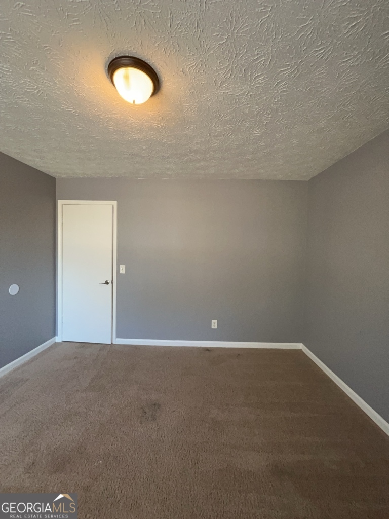 1682 Charmeth Road Lithonia, GA 30058 - Photo 31 of 52 a view of an empty room