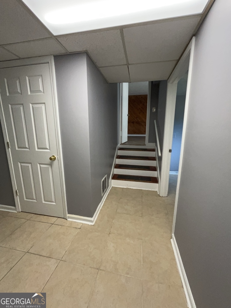 1682 Charmeth Road Lithonia, GA 30058 - Photo 34 of 52 a view of a livingroom with a staircase