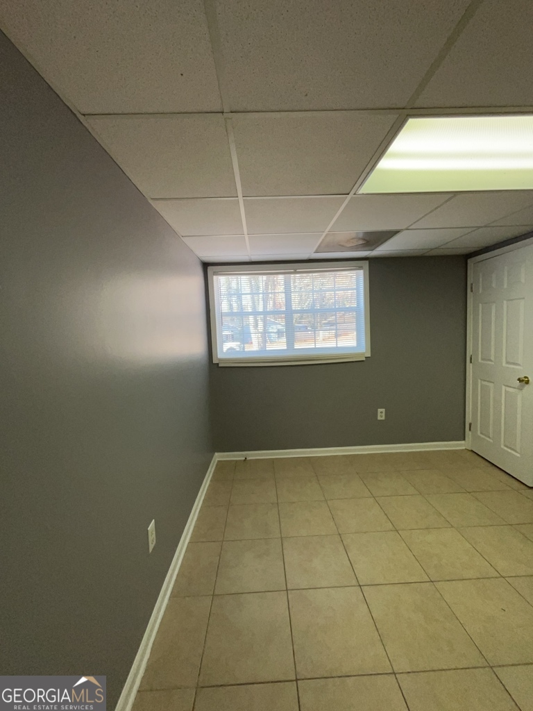 1682 Charmeth Road Lithonia, GA 30058 - Photo 47 of 52 a view of an empty room with a window