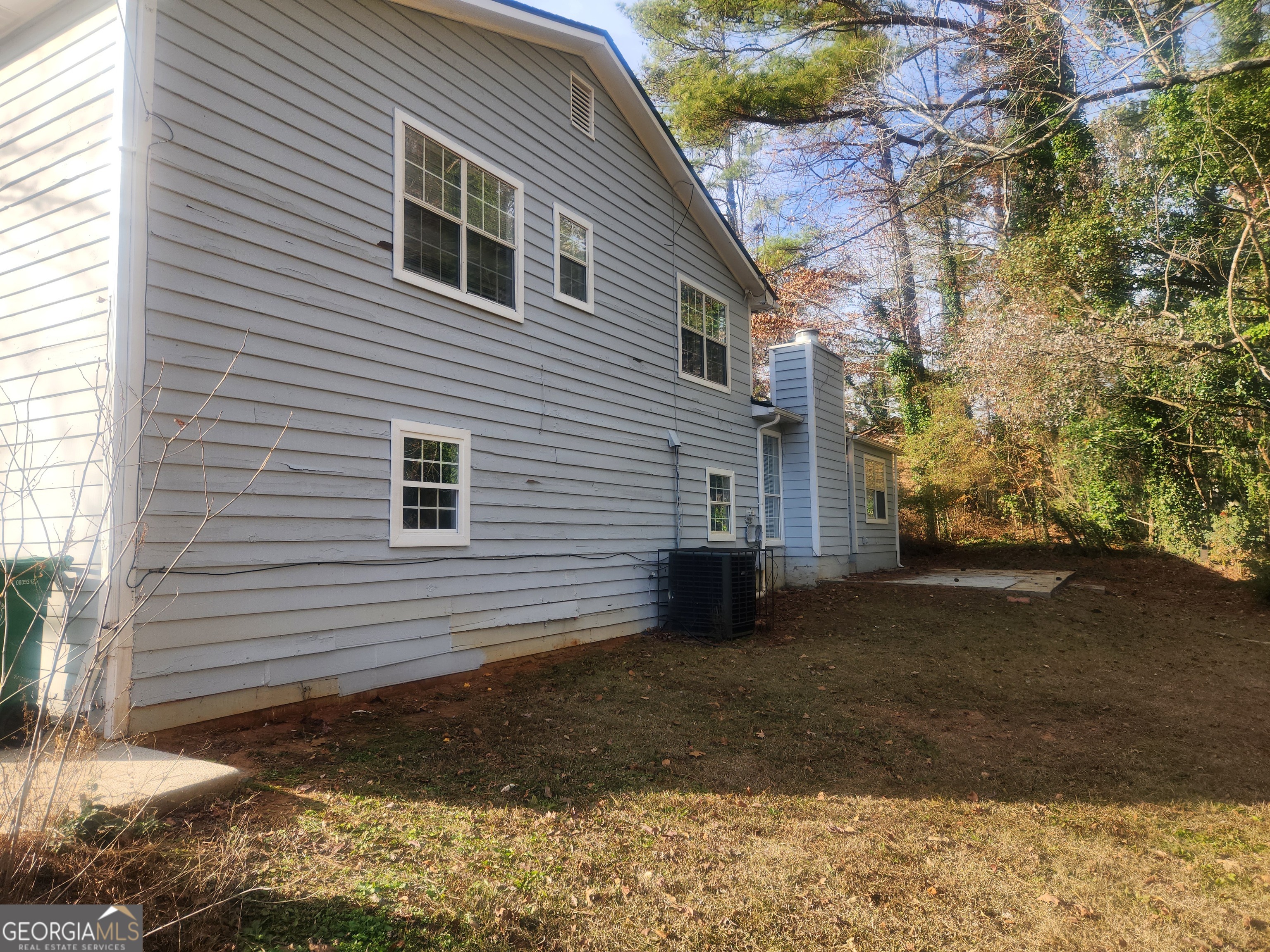 1682 Charmeth Road Lithonia, GA 30058 - Photo 49 of 52 a view of a house with a yard