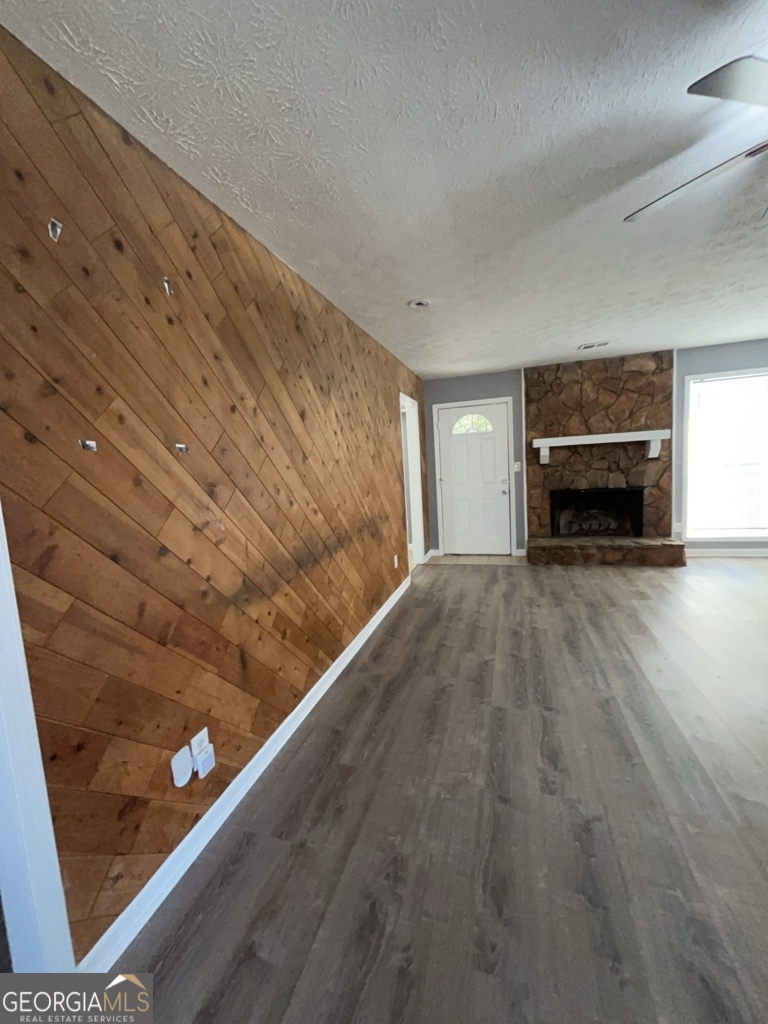 1682 Charmeth Road Lithonia, GA 30058 - Photo 6 of 52 a view of an empty room and fire place