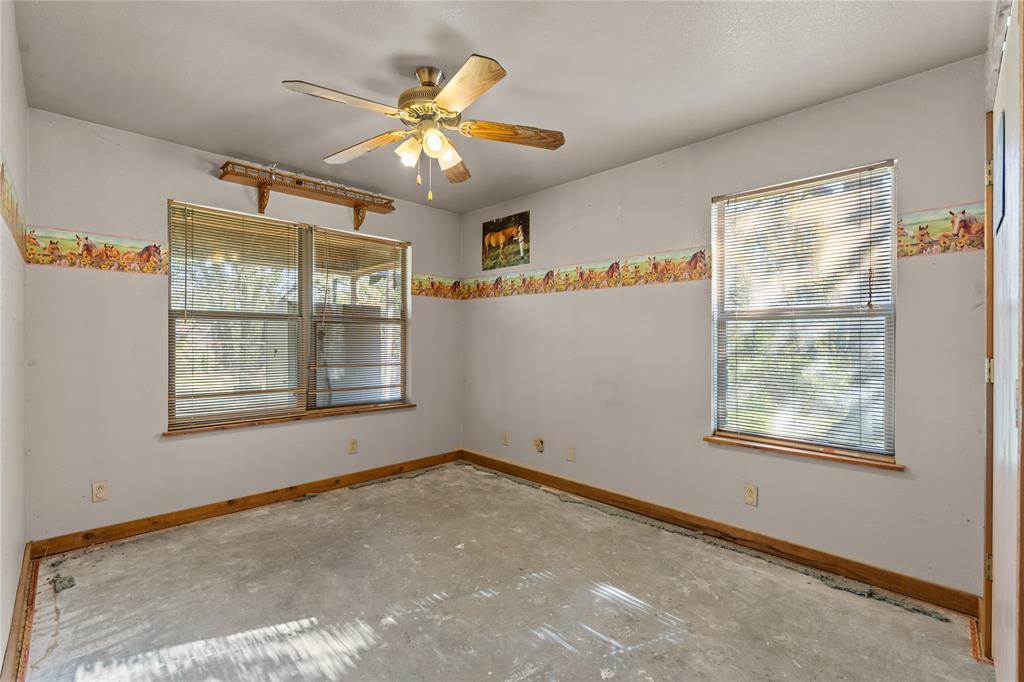 262 North Cheyenne Springtown, TX 76082 - Photo 15 of 35 Spare room with healthy amount of natural light and ceiling fan