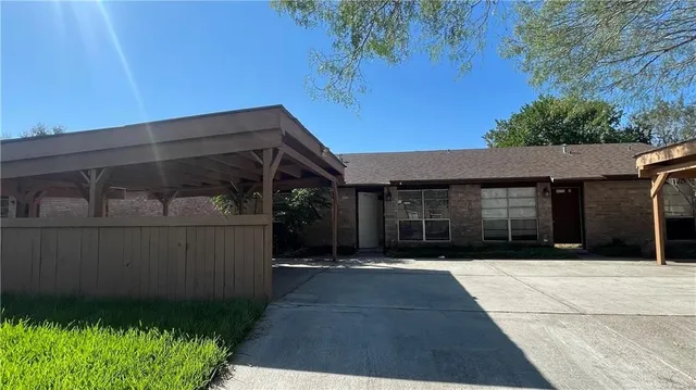 a front view of house with pathway