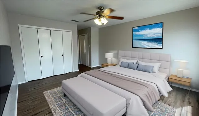 a bedroom with bed and a chandelier