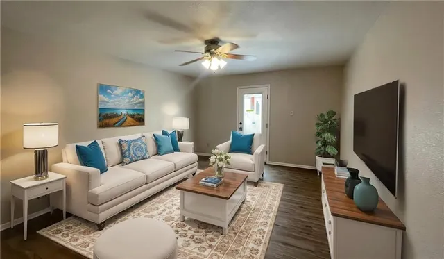 a living room with furniture and a flat screen tv