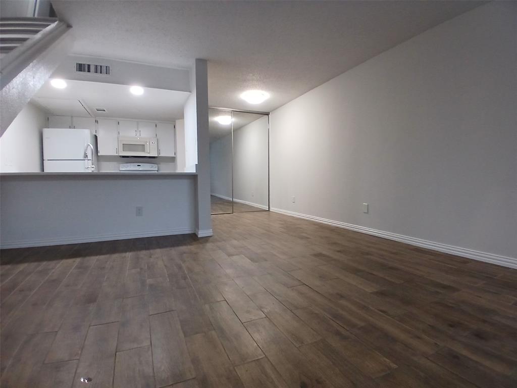 4640 Country Creek Drive, Unit 1257 Dallas, TX 75236 - Photo 2 of 11 a view of kitchen with wooden floor