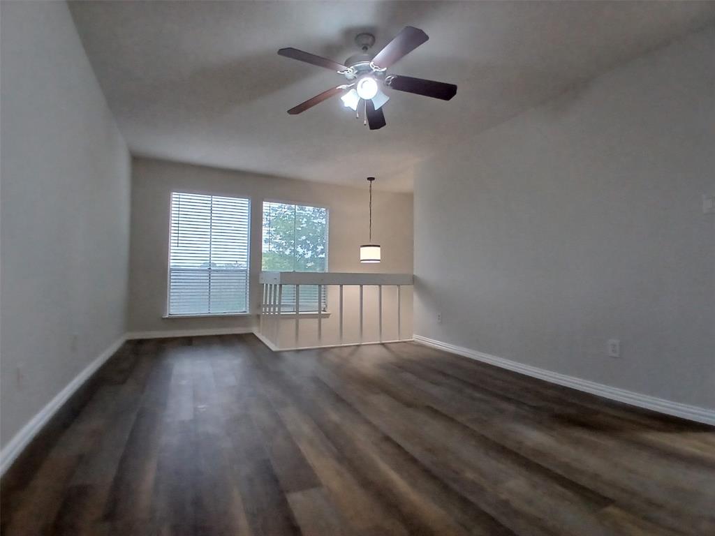 4640 Country Creek Drive, Unit 1257 Dallas, TX 75236 - Photo 8 of 11 a view of an empty room with wooden floor and a window