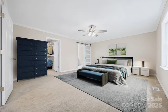 a bedroom with a bed and ceiling fan