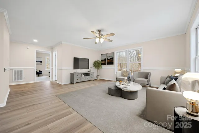 a bedroom with a bed couch and window