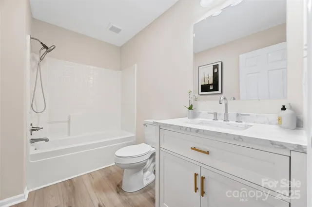 a bathroom with a sink a mirror and a shower